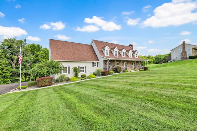331 Ridge Rd, Campbell Hall, NY 10916 - cape cod home with covered porch, a front yard, and a chimney