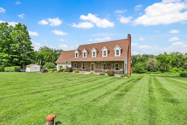 331 Ridge Rd, Campbell Hall, NY 10916 - new england style home with covered porch, a storage unit, a front lawn, and a chimney