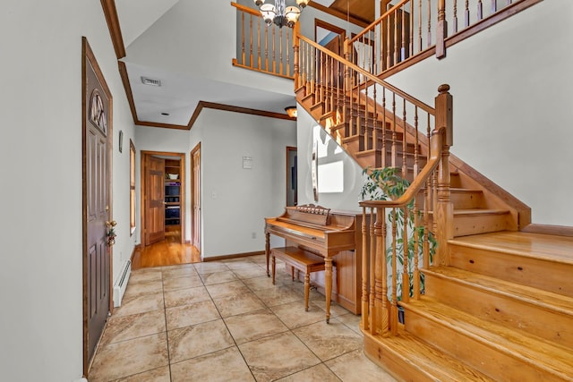 331 Ridge Rd, Campbell Hall, NY 10916 - foyer with stairs, ornamental molding, a chandelier, and a baseboard radiator