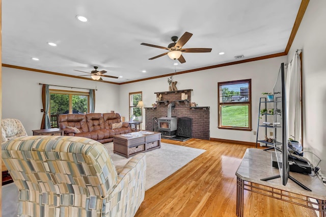 331 Ridge Rd, Campbell Hall, NY 10916 - living area featuring a ceiling fan, recessed lighting, light wood-type flooring, a wood stove, and ornamental molding