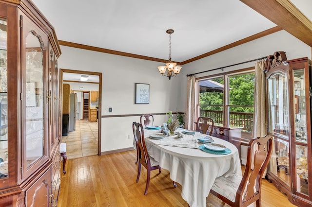 331 Ridge Rd, Campbell Hall, NY 10916 - dining room featuring light wood-type flooring, a chandelier, and crown molding