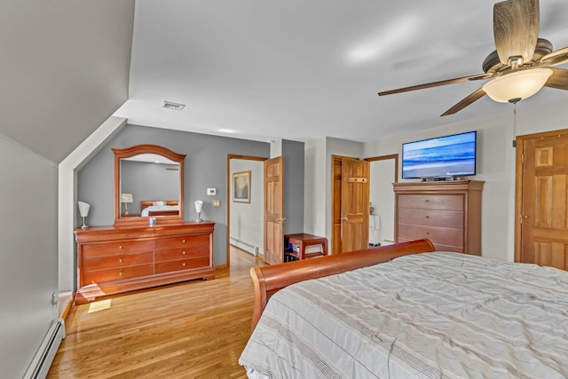 331 Ridge Rd, Campbell Hall, NY 10916 - bedroom featuring baseboard heating, light wood finished floors, and ceiling fan