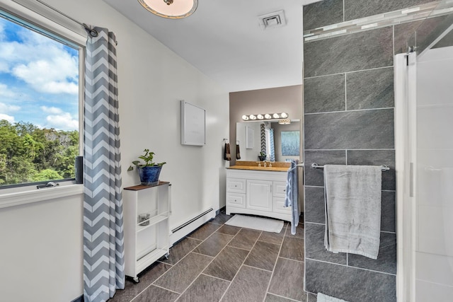 331 Ridge Rd, Campbell Hall, NY 10916 - full bath with a baseboard heating unit, vanity, and healthy amount of natural light