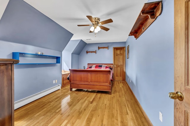 331 Ridge Rd, Campbell Hall, NY 10916 - bedroom with a baseboard heating unit, light wood-style flooring, and a ceiling fan