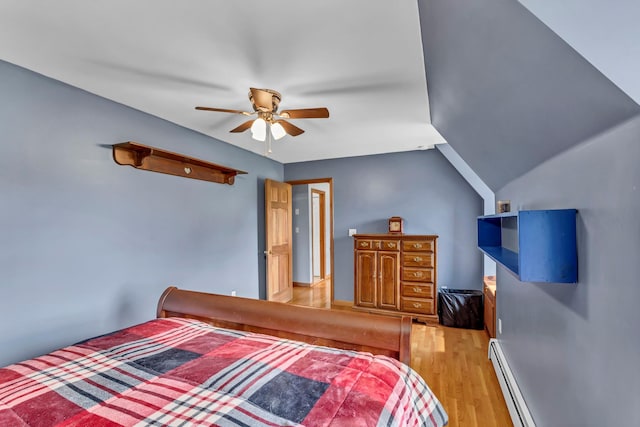 331 Ridge Rd, Campbell Hall, NY 10916 - bedroom featuring light wood-type flooring, a baseboard radiator, and ceiling fan