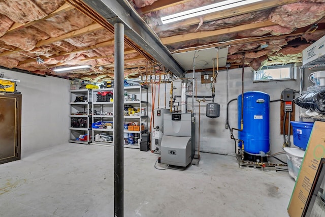 331 Ridge Rd, Campbell Hall, NY 10916 - basement featuring a water pressure tank and electric water heater