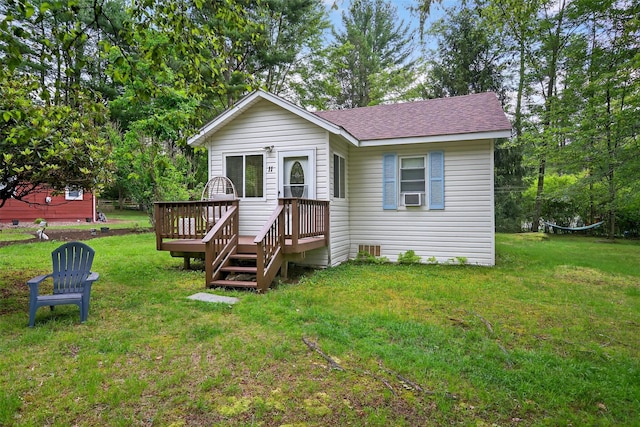 11 Apache Ln, Ferndale, NY 12734 - view of front of home with a shingled roof, a wooden deck, a front lawn, and cooling unit