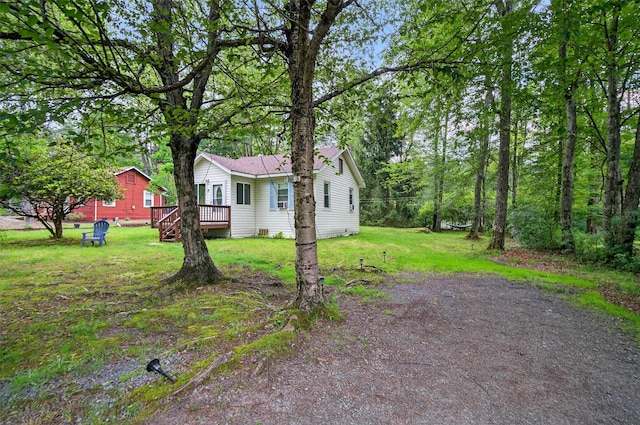 11 Apache Ln, Ferndale, NY 12734 - view of side of property with a wooden deck and a yard