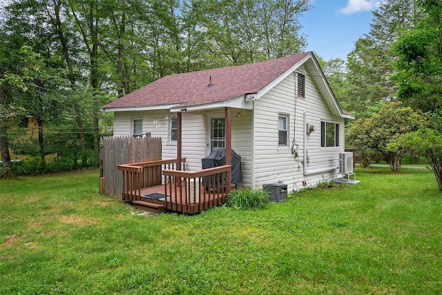 11 Apache Ln, Ferndale, NY 12734 - back of property with a shingled roof, a wooden deck, and a yard