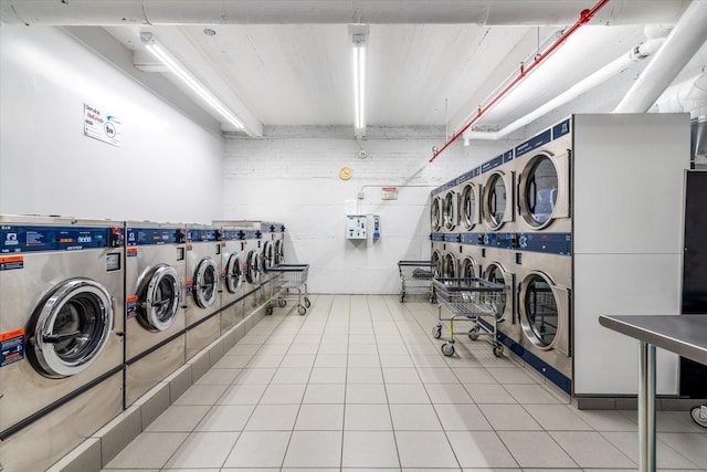 67-30 Clyde St Unit 3L, Forest Hills, NY 11375 - community laundry with washer and clothes dryer and light tile patterned floors