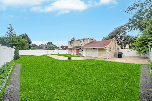 45 Potter Ln, Levittown, NY 11756 - rear view of property featuring a patio area, a fenced backyard, an attached garage, and concrete driveway