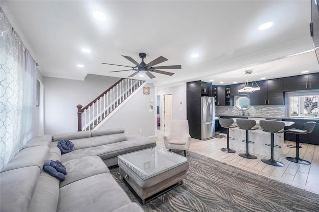 45 Potter Ln, Levittown, NY 11756 - living area with recessed lighting, a ceiling fan, stairway, and ornamental molding
