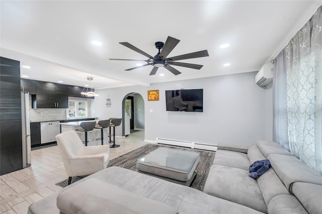 45 Potter Ln, Levittown, NY 11756 - living room featuring arched walkways, recessed lighting, ceiling fan, a wall unit AC, and a baseboard heating unit