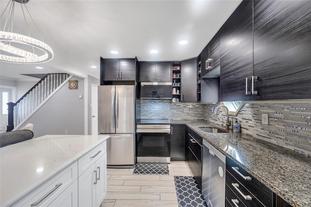 45 Potter Ln, Levittown, NY 11756 - kitchen featuring stainless steel appliances, backsplash, decorative light fixtures, light wood-style floors, and recessed lighting