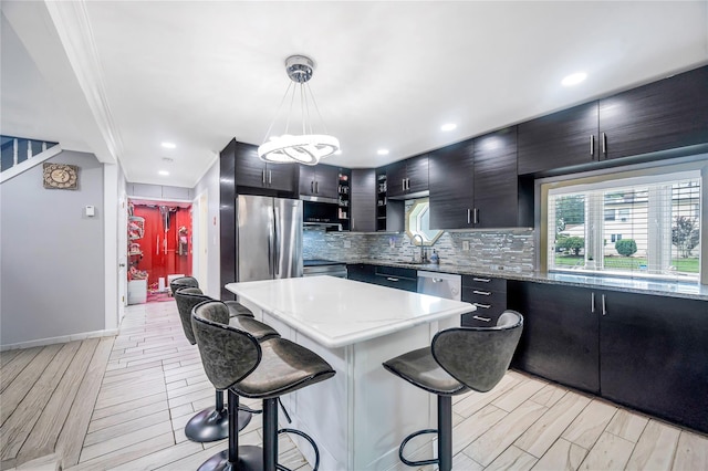 45 Potter Ln, Levittown, NY 11756 - kitchen with freestanding refrigerator, a breakfast bar, tasteful backsplash, open shelves, and pendant lighting