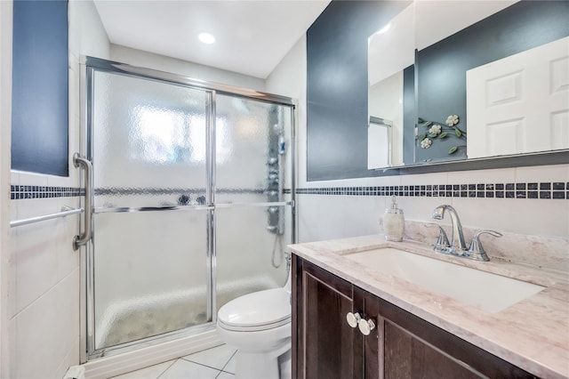 45 Potter Ln, Levittown, NY 11756 - full bathroom featuring tile walls, vanity, a shower stall, and tile patterned flooring