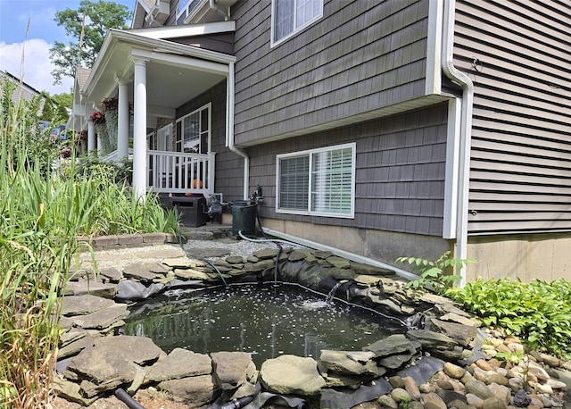 8 Mannes St, Ronkonkoma, NY 11779 - view of side of property with a small pond