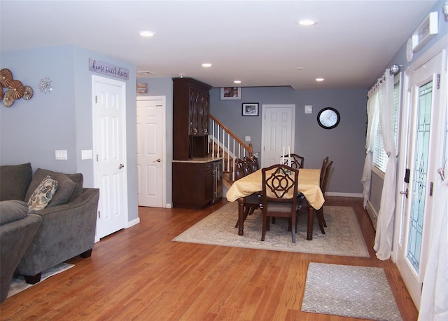 8 Mannes St, Ronkonkoma, NY 11779 - dining space with light wood-style floors, stairway, and recessed lighting