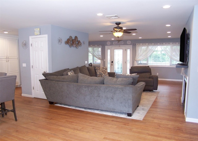 8 Mannes St, Ronkonkoma, NY 11779 - living room with plenty of natural light, a ceiling fan, light wood finished floors, and recessed lighting