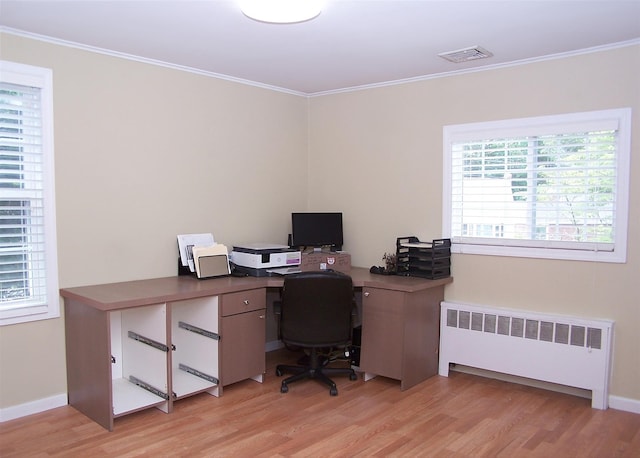 8 Mannes St, Ronkonkoma, NY 11779 - office area featuring radiator heating unit, light wood finished floors, and ornamental molding