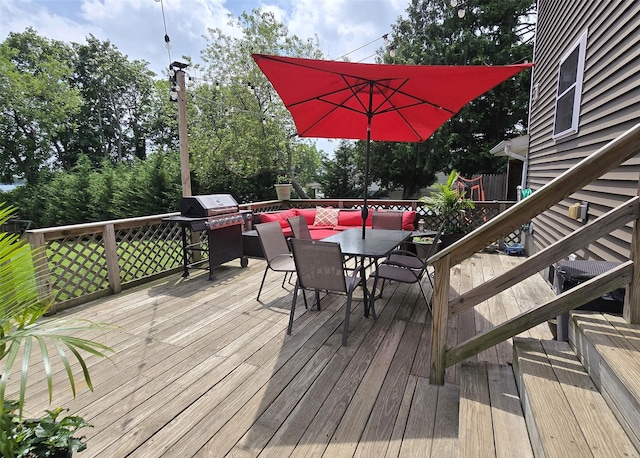 8 Mannes St, Ronkonkoma, NY 11779 - wooden terrace with outdoor dining area and a grill