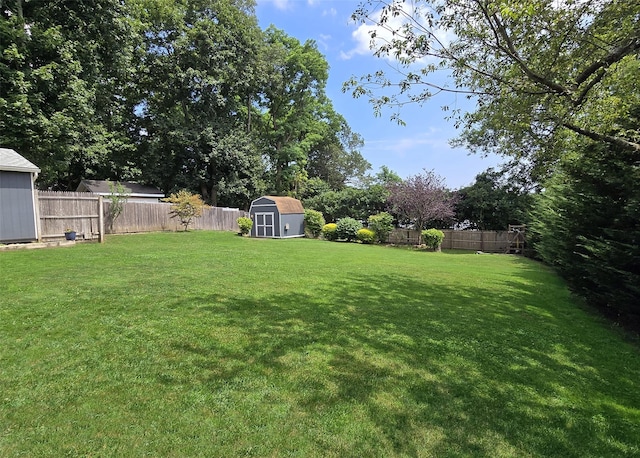 8 Mannes St, Ronkonkoma, NY 11779 - fenced backyard featuring a storage shed