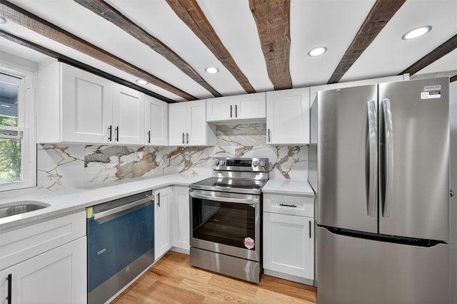 123 Newport Bridge Rd, Warwick, NY 10990 - kitchen with appliances with stainless steel finishes, light wood-style flooring, white cabinets, beamed ceiling, and decorative backsplash
