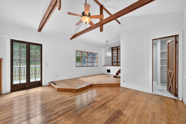 123 Newport Bridge Rd, Warwick, NY 10990 - unfurnished living room with french doors, plenty of natural light, light wood-type flooring, and stairway