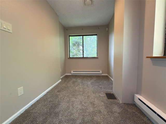 59 Meadowlark Ln, Woodridge, NY 12789 - carpeted empty room with a baseboard heating unit and a textured ceiling