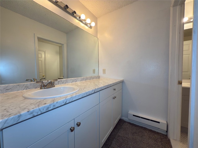 59 Meadowlark Ln, Woodridge, NY 12789 - bathroom featuring baseboard heating, vanity, and a textured ceiling