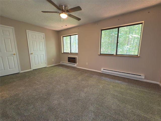 59 Meadowlark Ln, Woodridge, NY 12789 - unfurnished bedroom with baseboard heating, a textured ceiling, carpet floors, a wall mounted AC, and ceiling fan