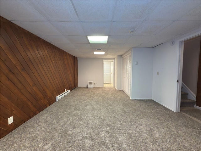 59 Meadowlark Ln, Woodridge, NY 12789 - finished basement with carpet flooring, baseboard heating, a paneled ceiling, stairway, and wooden walls