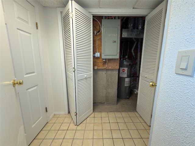 59 Meadowlark Ln, Woodridge, NY 12789 - hallway with electric water heater, electric panel, and light tile patterned floors