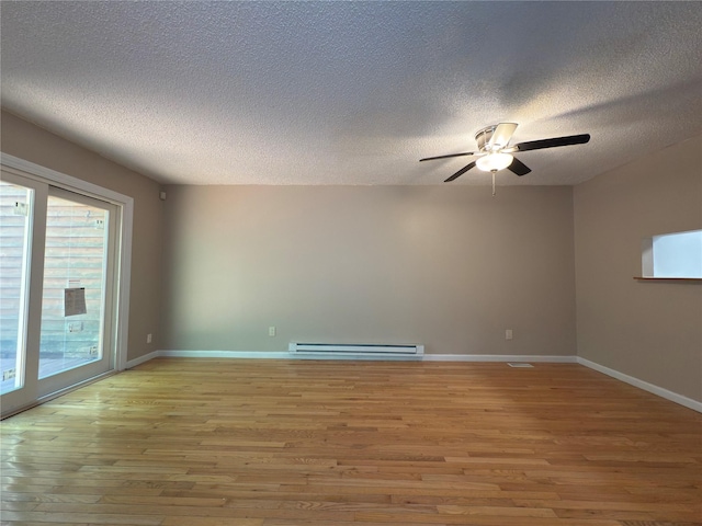 59 Meadowlark Ln, Woodridge, NY 12789 - spare room with baseboard heating, light wood-style flooring, ceiling fan, and a textured ceiling