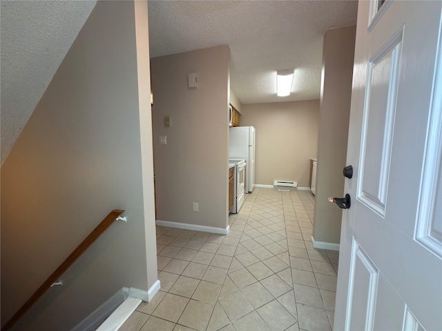 59 Meadowlark Ln, Woodridge, NY 12789 - corridor with a textured ceiling, light tile patterned flooring, a baseboard radiator, and an upstairs landing