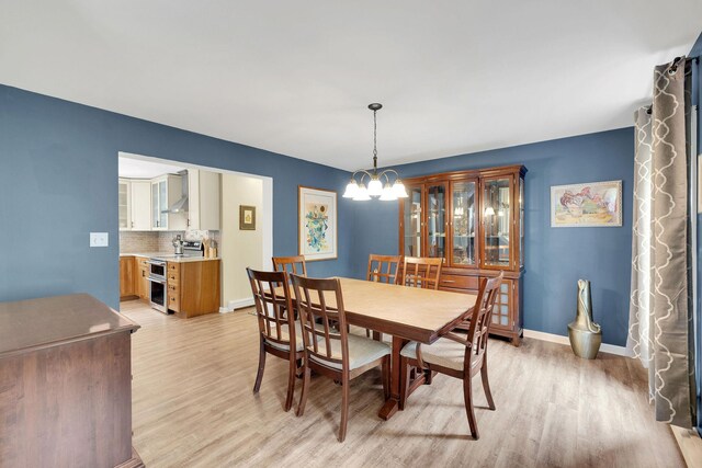 27 Balsam Rd, Hyde Park, NY 12538 - dining space featuring light wood finished floors and a chandelier