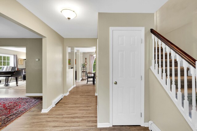 27 Balsam Rd, Hyde Park, NY 12538 - entryway with light wood-style floors, a baseboard heating unit, and stairway