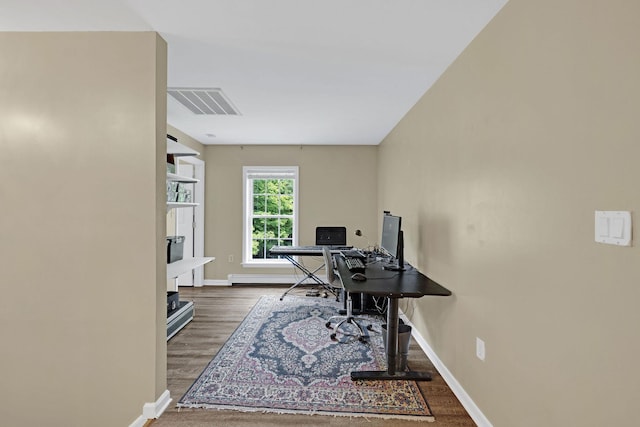 27 Balsam Rd, Hyde Park, NY 12538 - office space featuring wood finished floors and a baseboard radiator