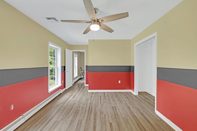 27 Balsam Rd, Hyde Park, NY 12538 - spare room with a baseboard heating unit and ceiling fan