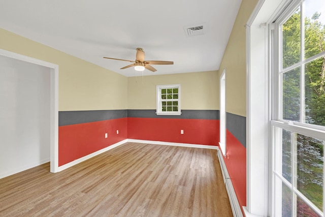 27 Balsam Rd, Hyde Park, NY 12538 - empty room featuring wood finished floors, a ceiling fan, and a baseboard radiator