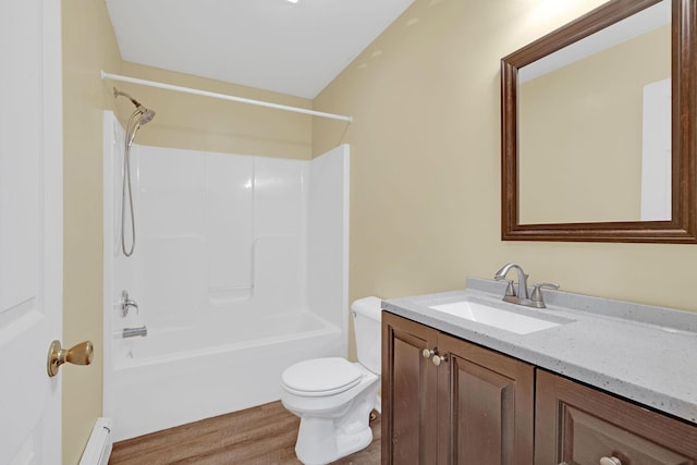 27 Balsam Rd, Hyde Park, NY 12538 - full bath with vanity, wood finished floors, shower / bath combination, and a baseboard radiator
