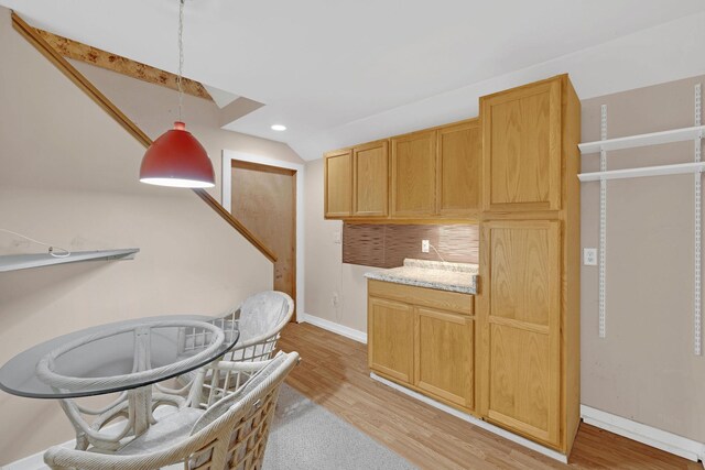 27 Balsam Rd, Hyde Park, NY 12538 - kitchen with lofted ceiling, light wood-type flooring, decorative light fixtures, and light countertops