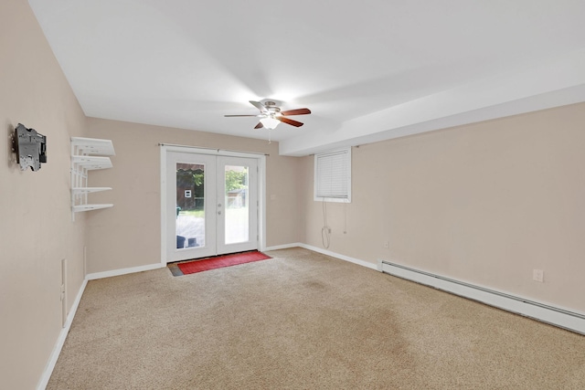 27 Balsam Rd, Hyde Park, NY 12538 - carpeted spare room featuring a baseboard heating unit, ceiling fan, and french doors