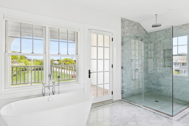 1 Fiske Ave, Westhampton Beach, NY 11978 - full bathroom with a marble finish shower, a soaking tub, healthy amount of natural light, lofted ceiling, and marble tiled floors