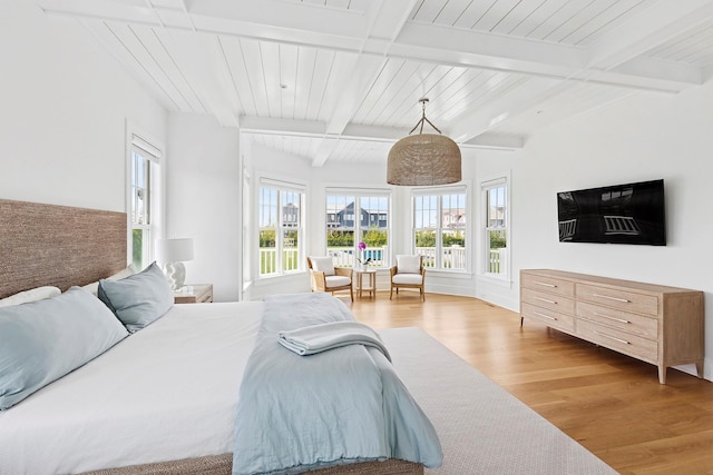 1 Fiske Ave, Westhampton Beach, NY 11978 - bedroom featuring wood finished floors, multiple windows, and beamed ceiling