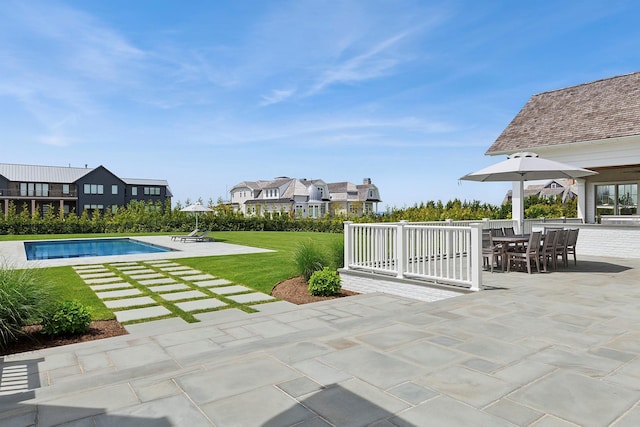 1 Fiske Ave, Westhampton Beach, NY 11978 - view of patio with an outdoor pool, a residential view, and outdoor dining area