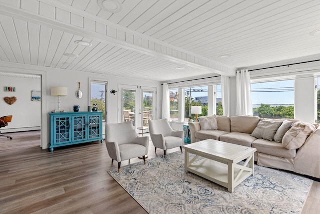 8 The Fairway, Oak Beach, NY 11702 - living room with a wooden ceiling with exposed beams, wood finished floors, a baseboard heating unit, and french doors