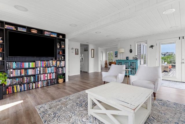 8 The Fairway, Oak Beach, NY 11702 - living area featuring plenty of natural light, a wood ceiling with exposed beams, and wood finished floors