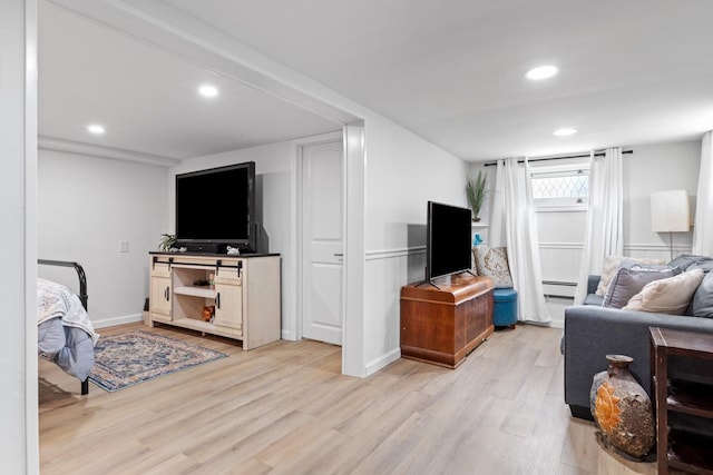 8 The Fairway, Oak Beach, NY 11702 - living area featuring light wood-style floors, baseboard heating, and recessed lighting