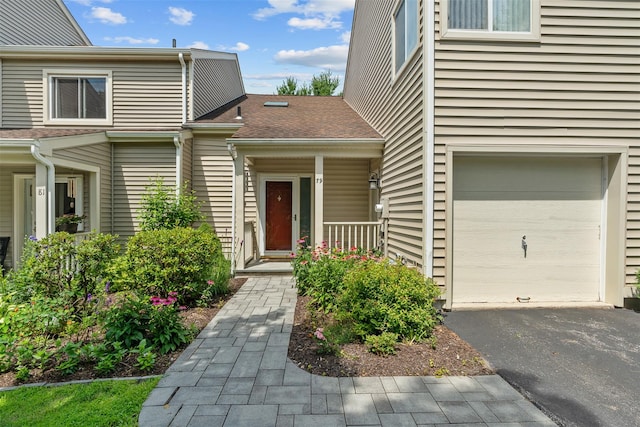 79 Meadow Way, Hopewell Junction, NY 12533 - doorway to property with an attached garage, driveway, and a shingled roof